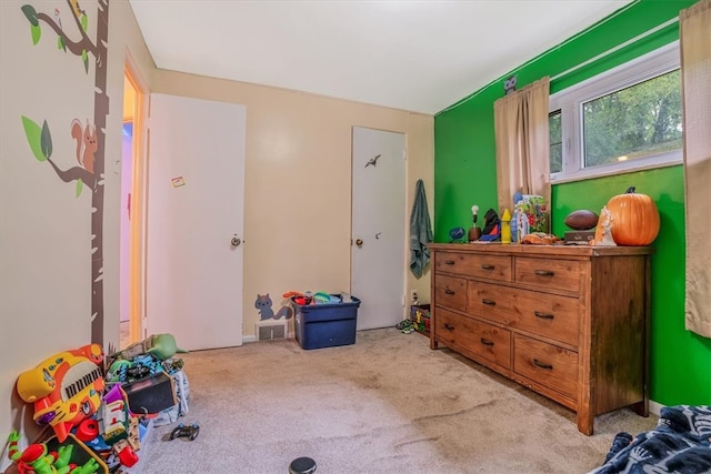 game room with light colored carpet