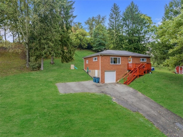 exterior space featuring a garage and a front lawn