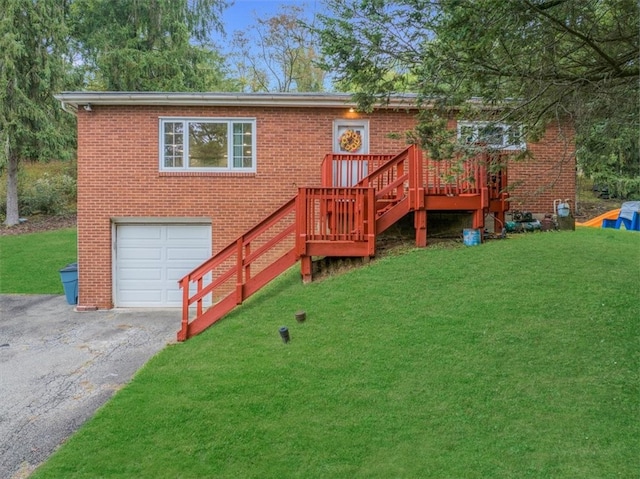 view of front facade featuring a deck, a garage, and a front lawn