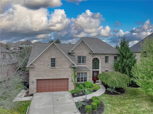 view of front of house with a front lawn and a garage