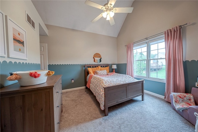 carpeted bedroom featuring ceiling fan and high vaulted ceiling