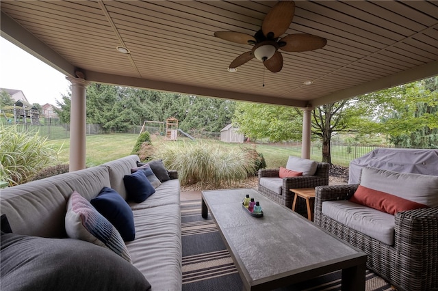 view of patio with ceiling fan, an outdoor hangout area, and a storage unit