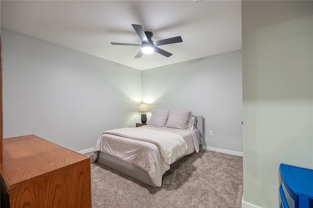 bedroom with ceiling fan and light colored carpet