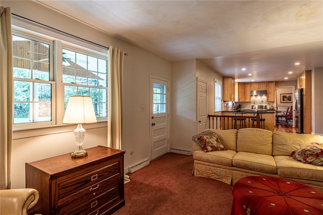 carpeted living room featuring a baseboard radiator