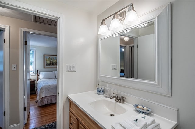 bathroom with vanity and hardwood / wood-style floors