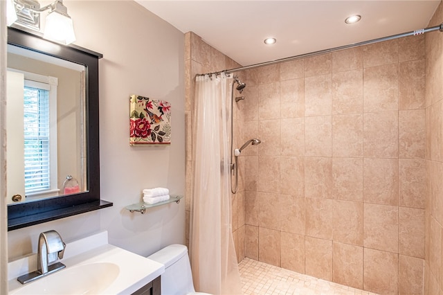 bathroom with toilet, vanity, a shower with shower curtain, and tile patterned floors