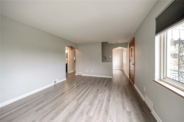 unfurnished room featuring light wood-type flooring