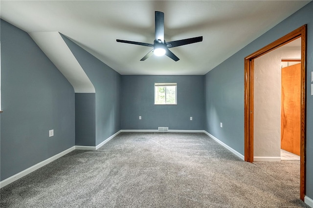 bonus room with carpet flooring, vaulted ceiling, and ceiling fan