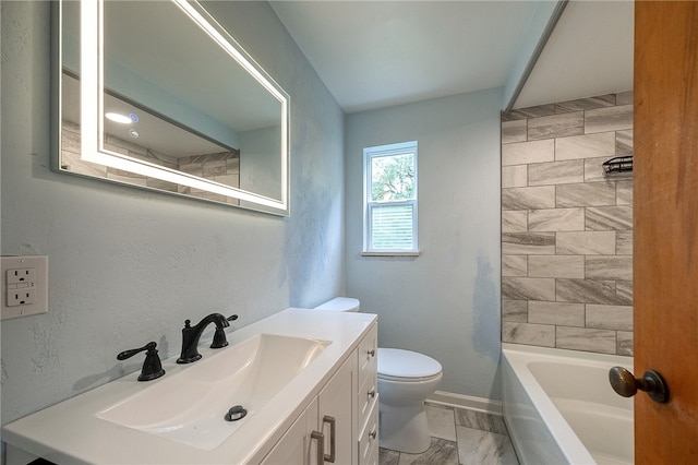 full bathroom featuring vanity, tiled shower / bath combo, and toilet