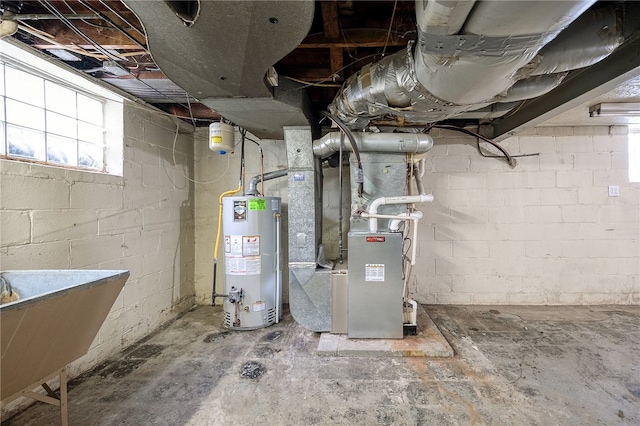 utility room with gas water heater, sink, and heating unit