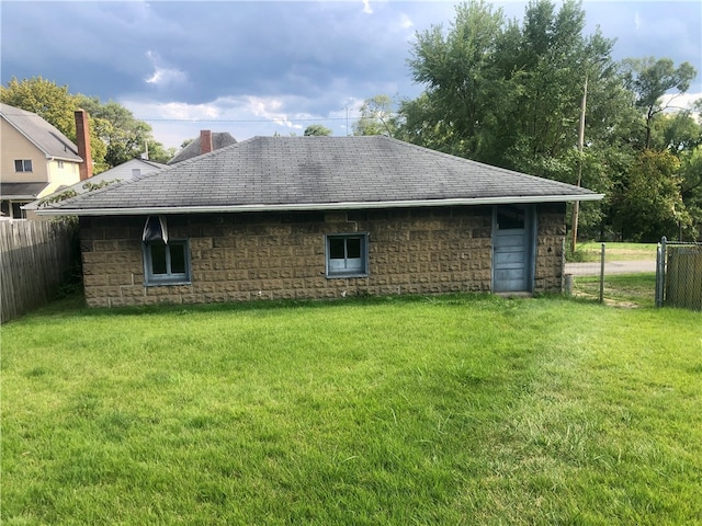 view of home's exterior with a yard