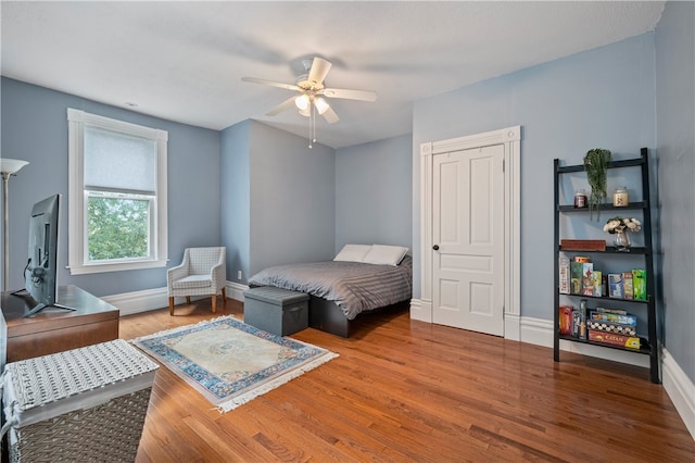 bedroom featuring ceiling fan and wood-type flooring