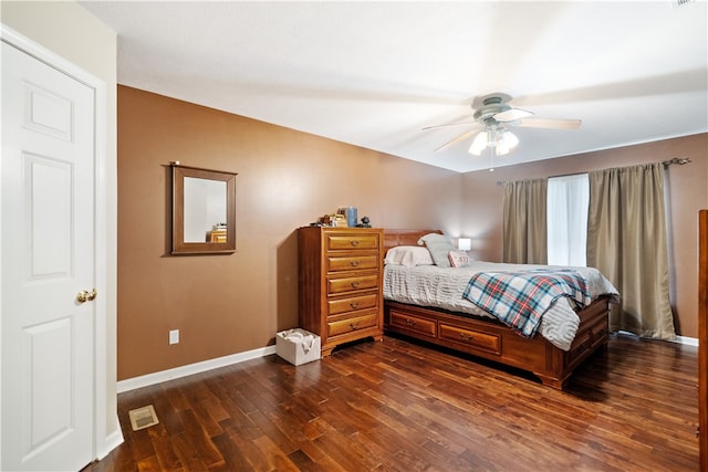 bedroom featuring ceiling fan and dark hardwood / wood-style floors