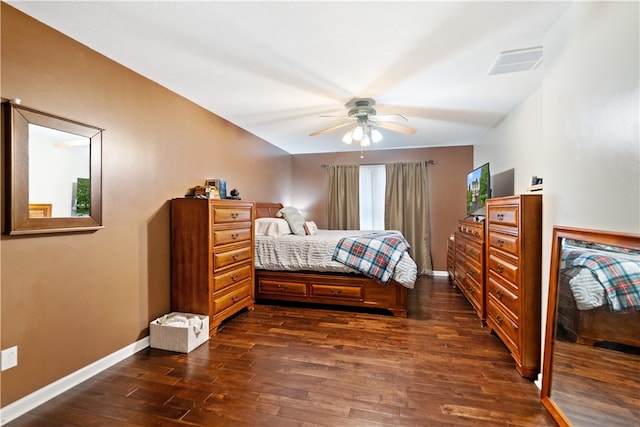 bedroom with ceiling fan and dark hardwood / wood-style flooring