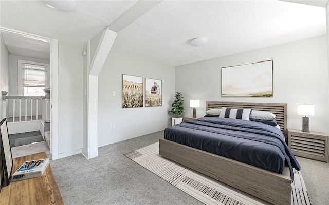 bedroom featuring light carpet