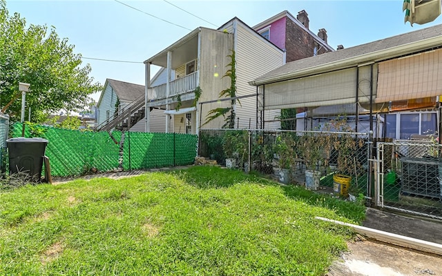 view of yard featuring central air condition unit