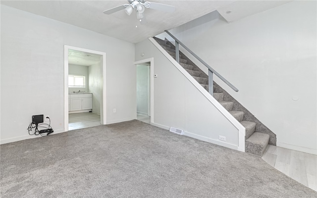 unfurnished living room with hardwood / wood-style floors and ceiling fan