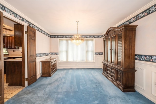 dining room with light carpet, an inviting chandelier, and crown molding