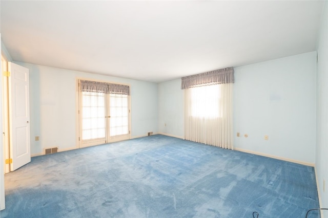 unfurnished room featuring carpet flooring