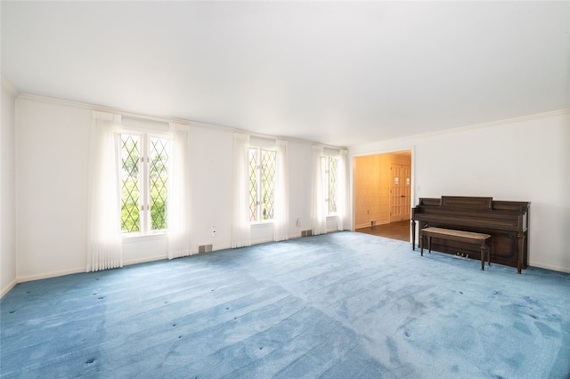 interior space featuring carpet and crown molding