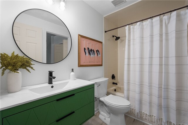 full bathroom with vanity, toilet, shower / bath combo with shower curtain, and hardwood / wood-style flooring