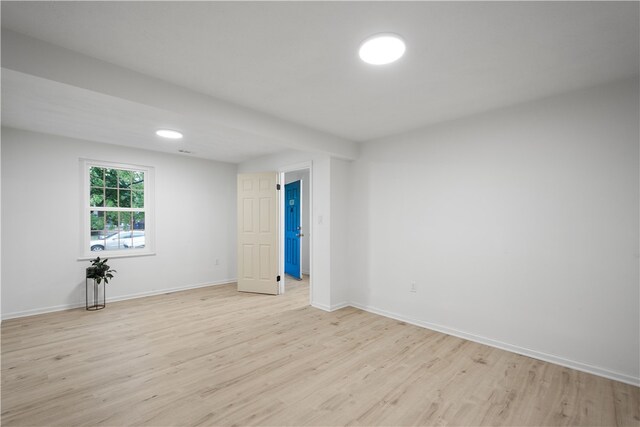 unfurnished room with light hardwood / wood-style flooring