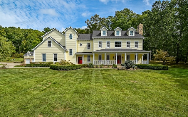 view of front of property featuring a front lawn and a porch