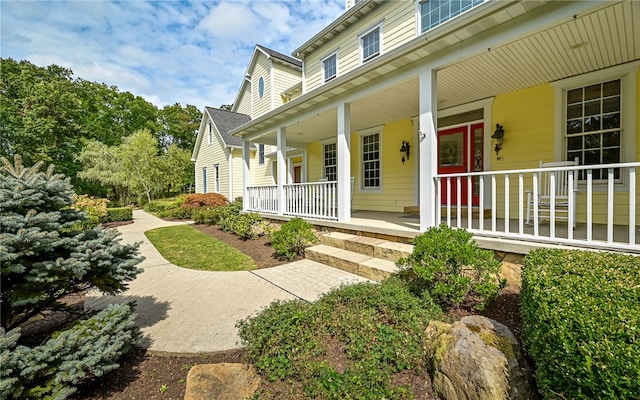 doorway to property featuring a porch