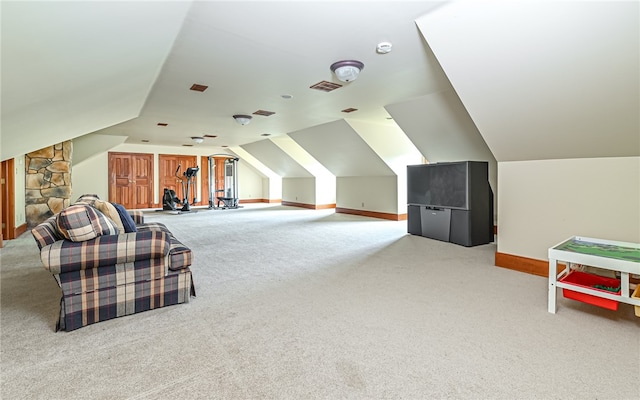 bedroom featuring lofted ceiling and carpet flooring