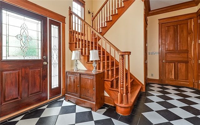 foyer featuring crown molding