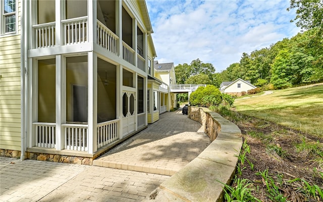 view of property exterior featuring a patio