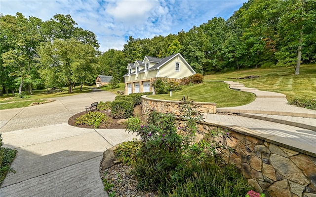 view of property's community with a lawn