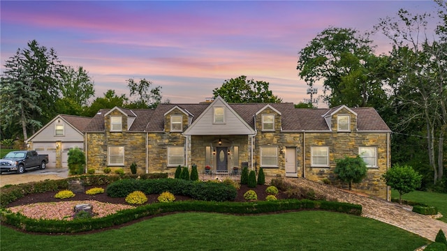 view of front of property with a lawn