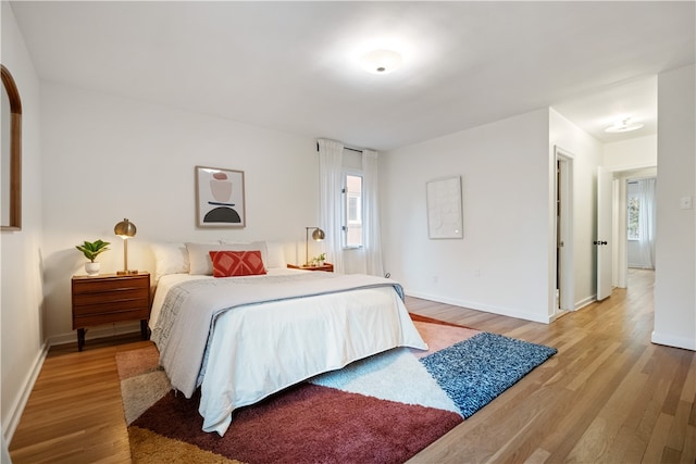 bedroom with hardwood / wood-style flooring