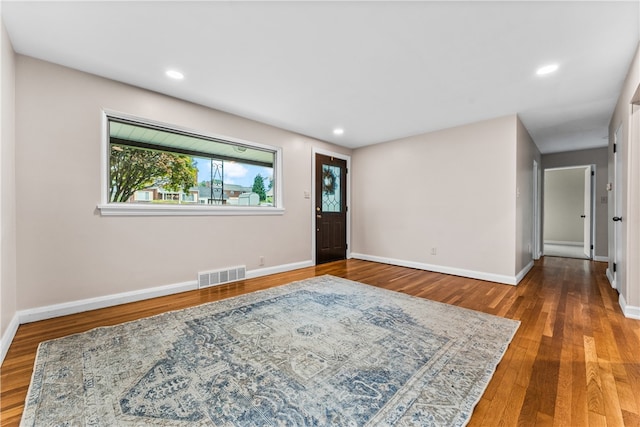 foyer entrance with hardwood / wood-style floors