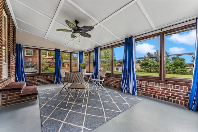 sunroom / solarium featuring ceiling fan and vaulted ceiling