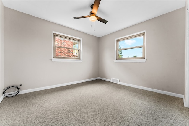 unfurnished room with carpet and ceiling fan