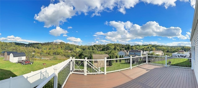 wooden terrace with a yard