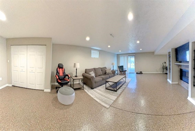 living room with a textured ceiling