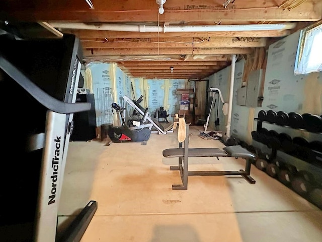 workout room featuring concrete floors