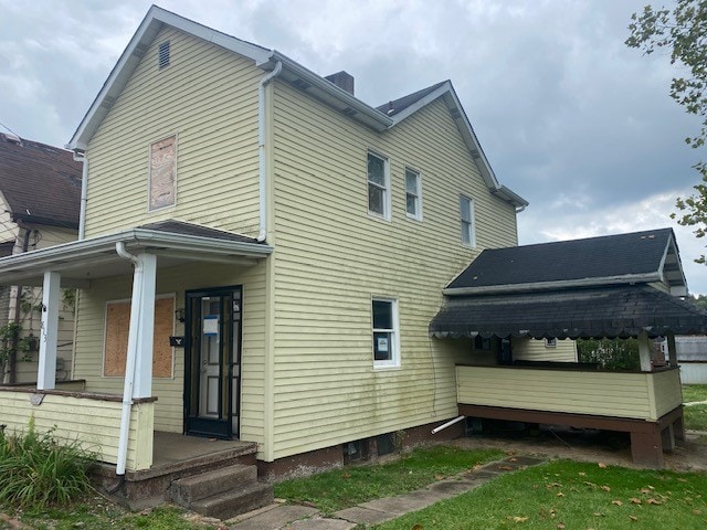 view of property exterior featuring covered porch