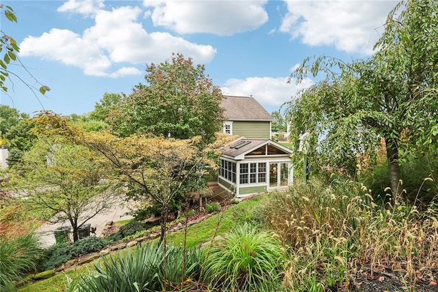 back of property featuring a sunroom