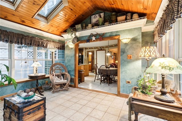 living area with vaulted ceiling with skylight, tile patterned floors, and wooden ceiling