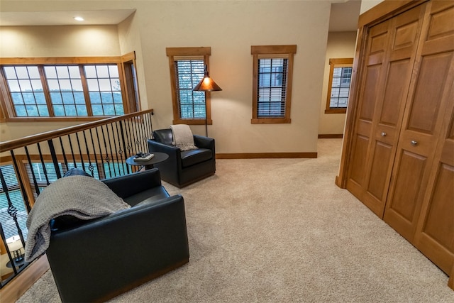 living area featuring light colored carpet