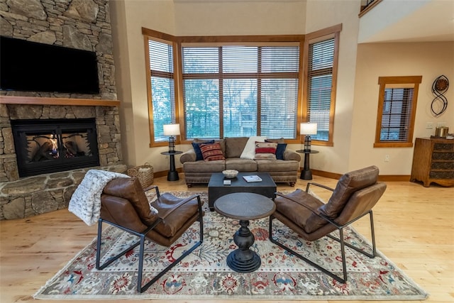 living room featuring light hardwood / wood-style floors and a fireplace