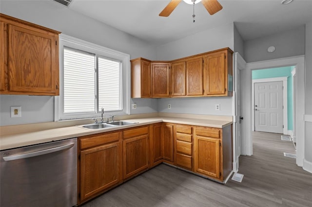 kitchen with wood-type flooring, ceiling fan, sink, and stainless steel dishwasher