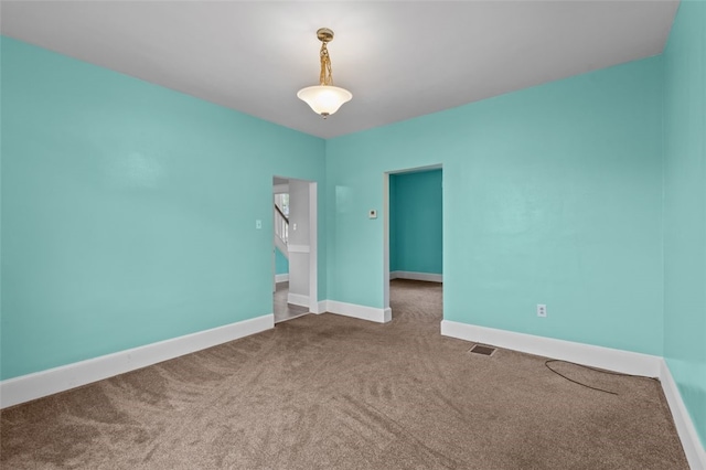 unfurnished room featuring carpet floors