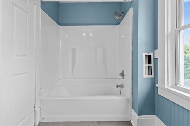 bathroom with shower / tub combination