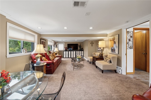 carpeted living room featuring ornamental molding