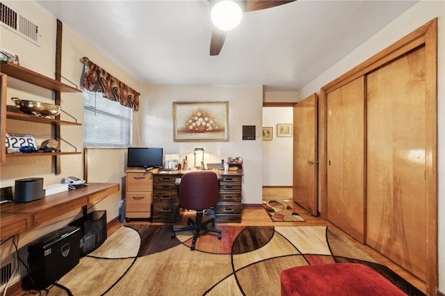 office space featuring ceiling fan and light hardwood / wood-style flooring